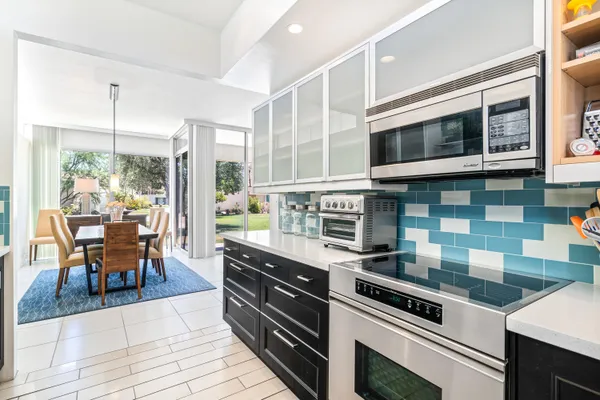 a spacious bedroom with a large bed and a large window