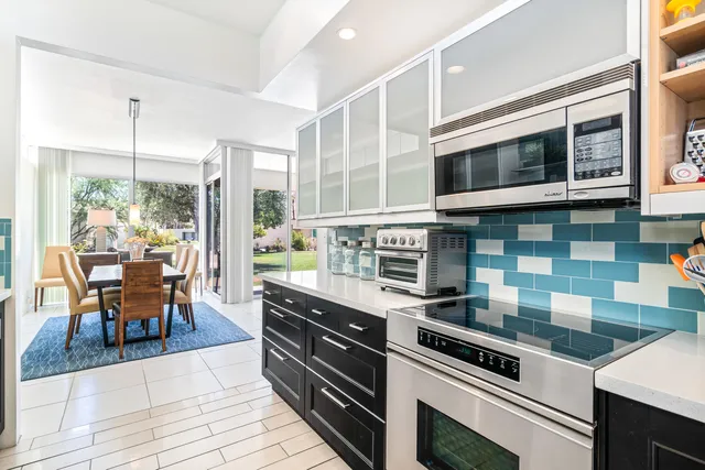 a spacious bedroom with a large bed and a large window