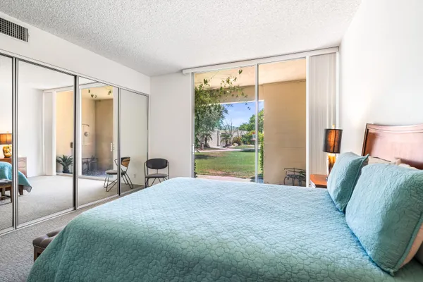 a bathroom with a shower sink and mirror