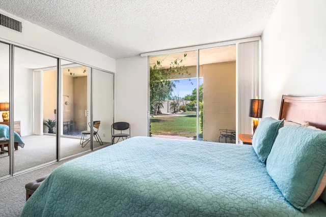 a bathroom with a shower sink and mirror