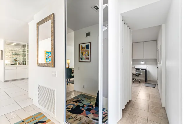 a view of a house with backyard and porch