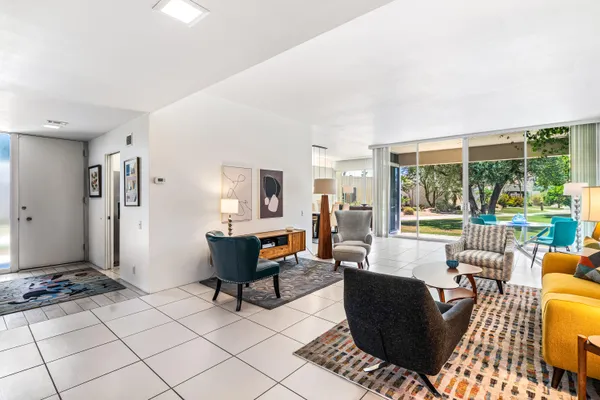 a living room with furniture and a large window