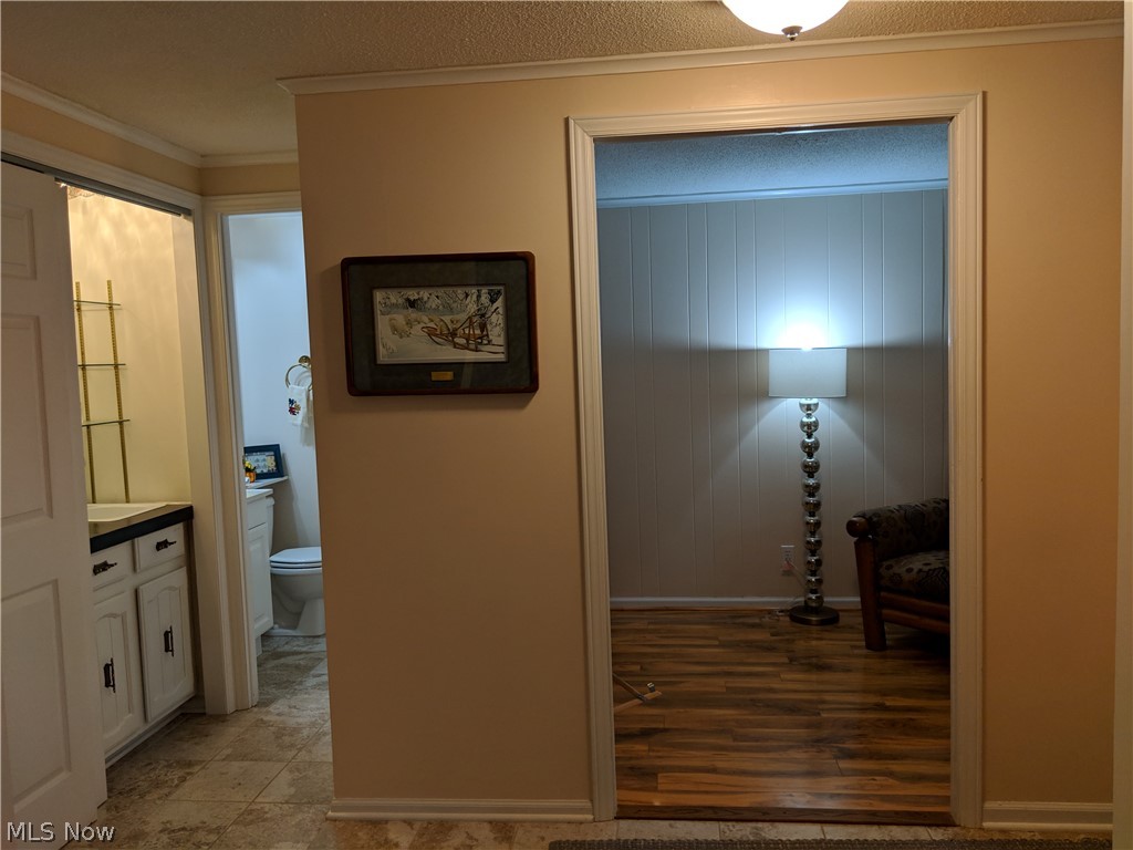958 Som Center Road, Unit C3 Cleveland, OH 44143 - Photo 6 of 33 front hall with office, half bathroom, wet bar, and hall closet
