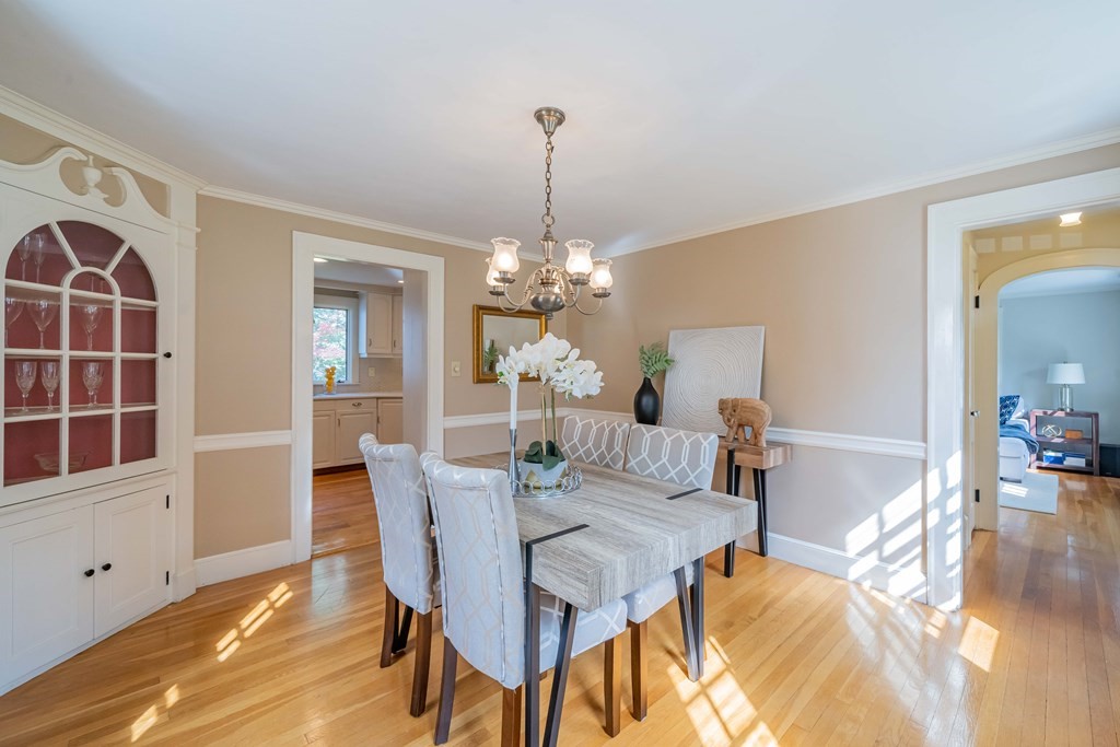 97 Blake Road Lexington, MA 02420 - Photo 11 of 42 a view of a dining room with furniture and wooden floor