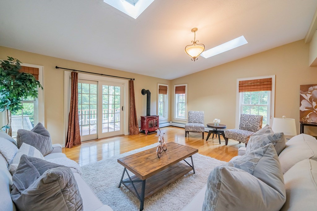 97 Blake Road Lexington, MA 02420 - Photo 24 of 42 a living room with furniture a table and a window