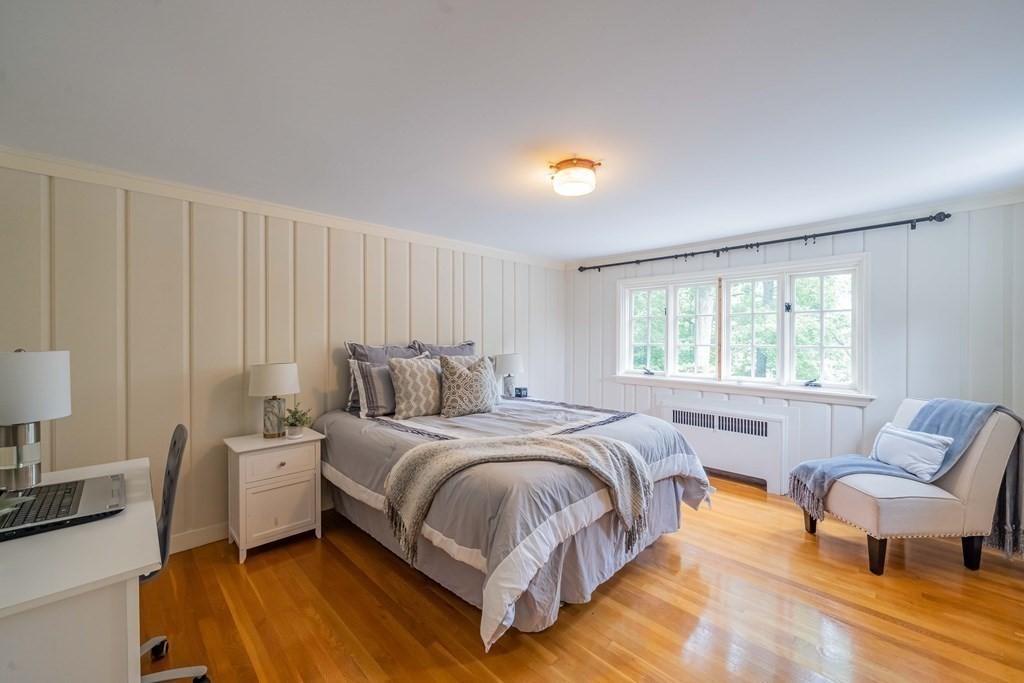 97 Blake Road Lexington, MA 02420 - Photo 35 of 42 a bedroom with a bed and a couch