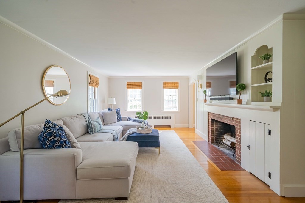 97 Blake Road Lexington, MA 02420 - Photo 5 of 42 a living room with furniture and a fireplace