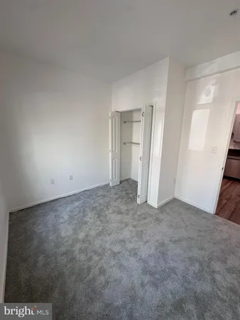 a view of a room with wooden floor and staircase