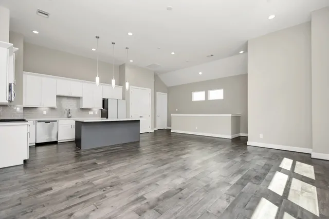 a view of kitchen with wooden floor