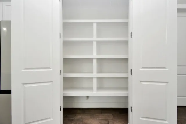 a view of an empty walk in closet