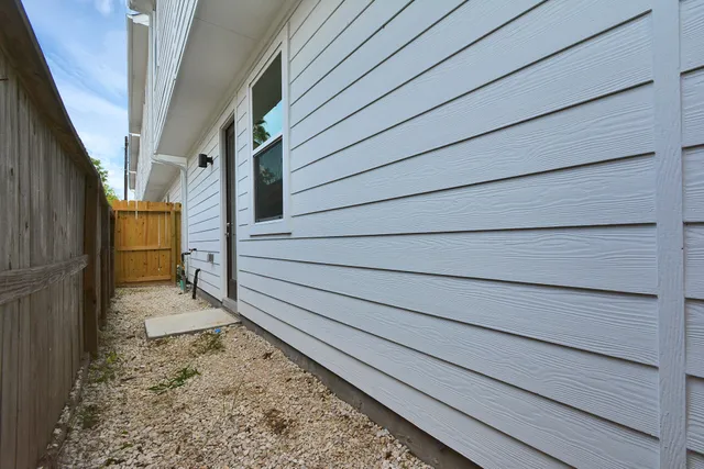 a view of outdoor space with wooden fence