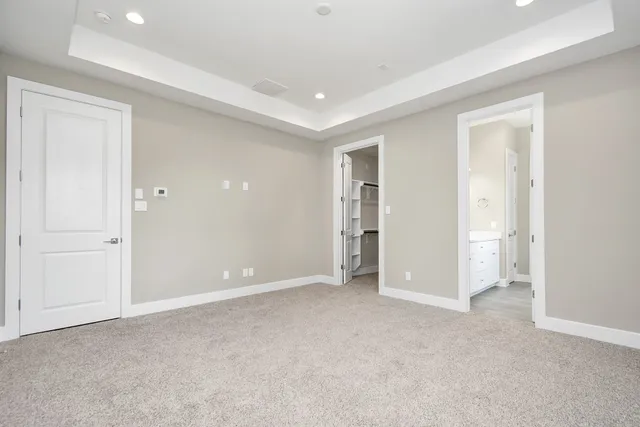 a view of an empty room and closet area
