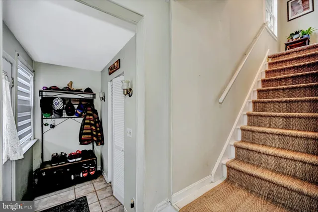 a view of bedroom with wooden floor and stairs