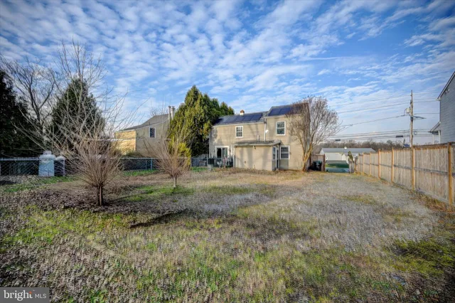 a view of a patio with table and chairs and potted plants