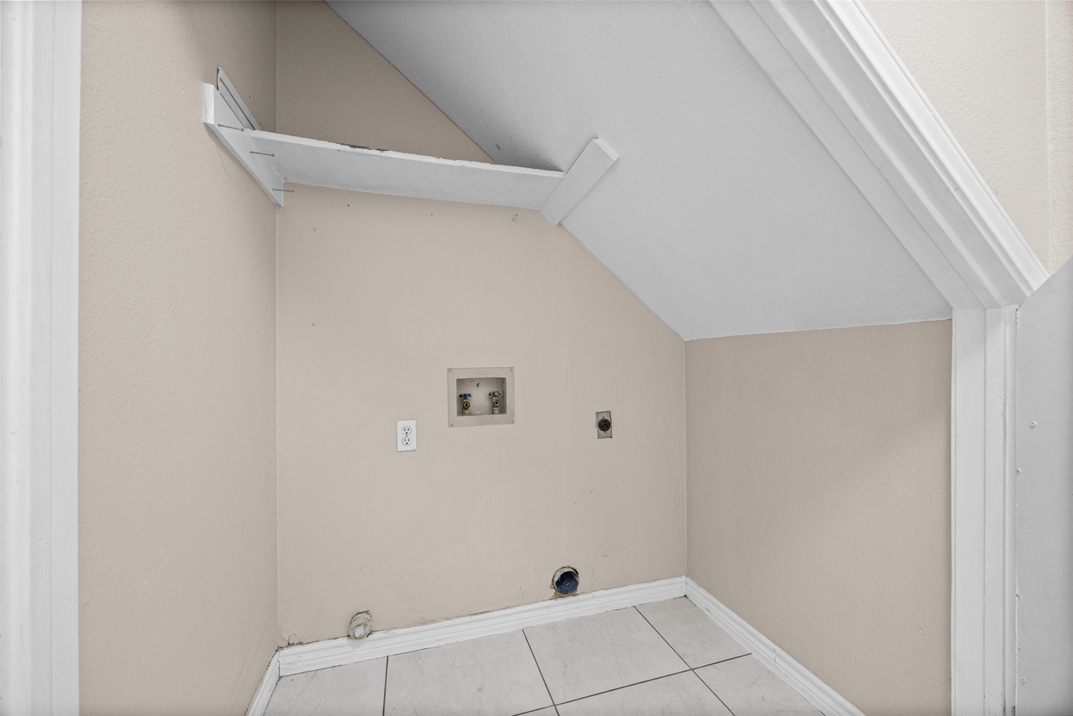 2432 Roundabout Lane Round Rock, TX 78664 - Photo 10 of 22 Ready for your washer and dryer, this dedicated utility space offers practical organization.