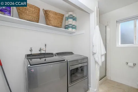 a bedroom with a bed and a flat tv screen