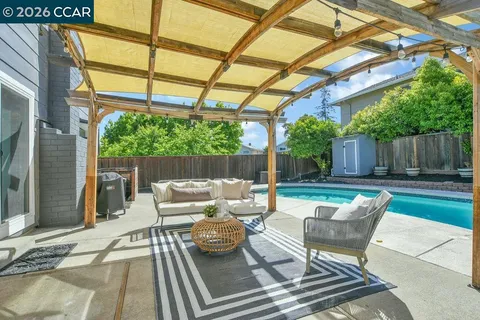 a view of a swimming pool with a patio