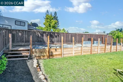a swimming pool with wooden fence