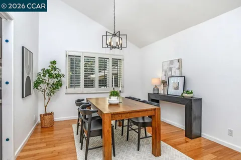 a kitchen with stainless steel appliances granite countertop a stove and a refrigerator