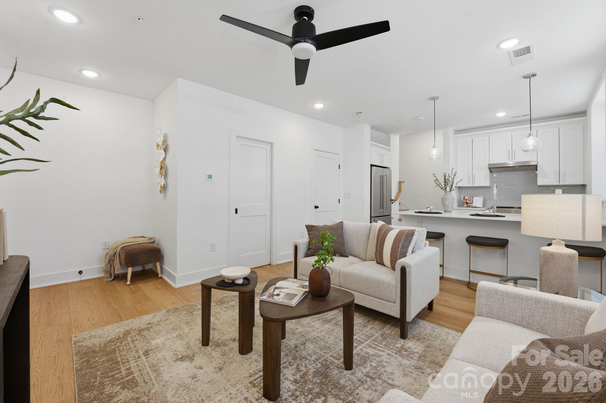 201 Grandin Road, Unit 6 Charlotte, NC 28208 - Photo 2 of 45 a living room with furniture and a ceiling fan