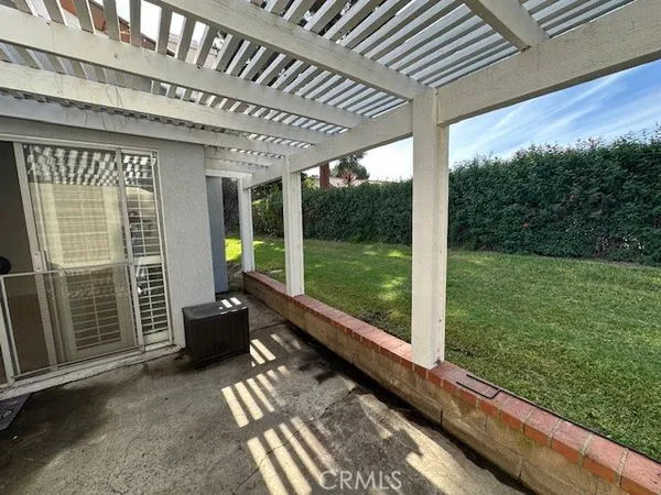 a view of a porch with furniture and yard