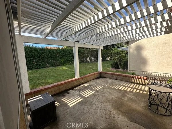 a view of a porch with wooden floor and outdoor space