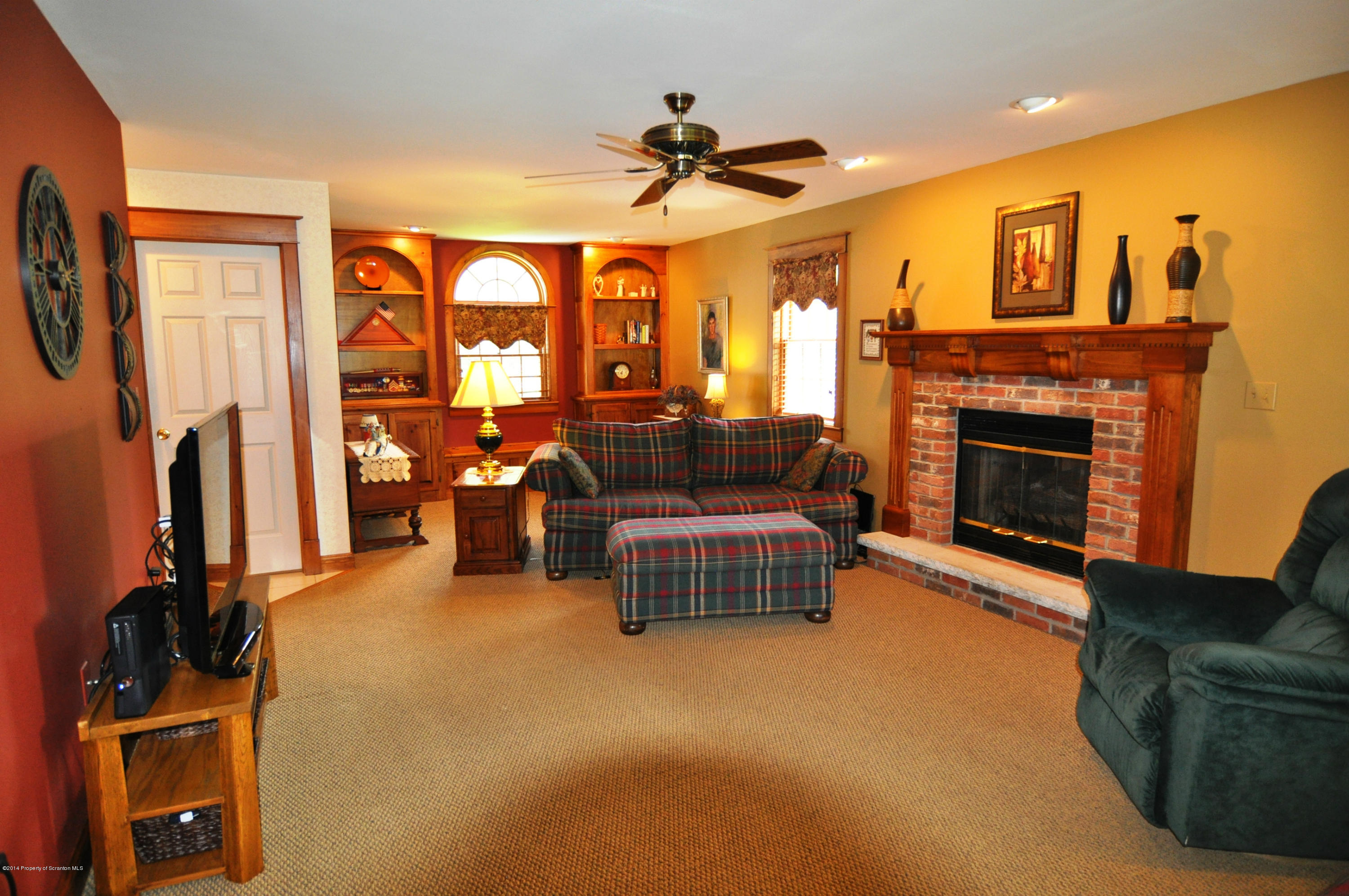 116 Griffin Road Moscow, PA 18444 - Photo 2 of 50 a living room with furniture and a fireplace