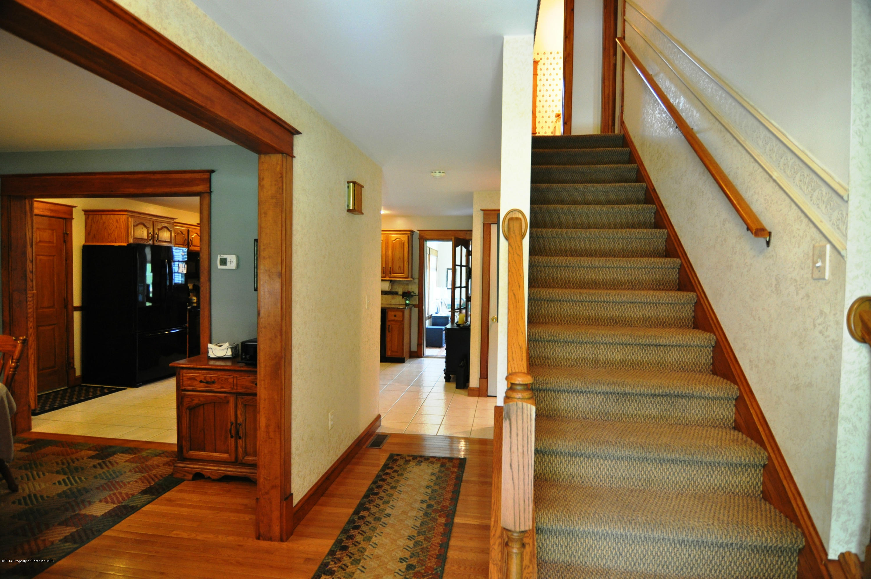 116 Griffin Road Moscow, PA 18444 - Photo 21 of 50 a view of a hallway with wooden floor and staircase