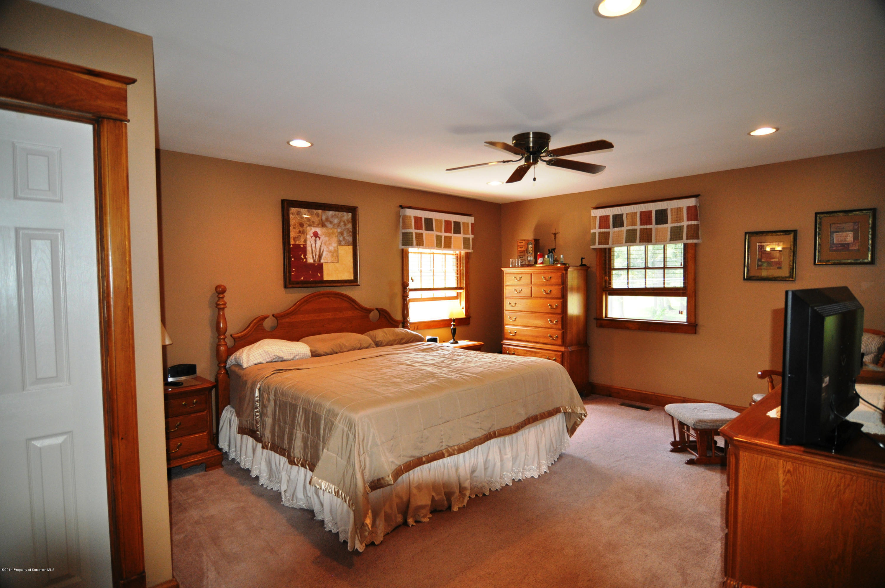 116 Griffin Road Moscow, PA 18444 - Photo 22 of 50 a bed room with a bed and a tv