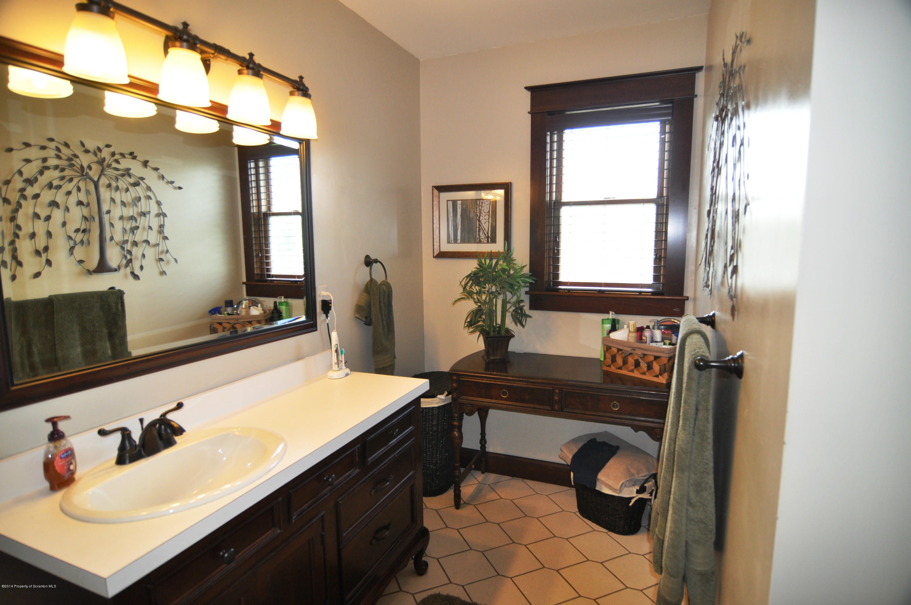 116 Griffin Road Moscow, PA 18444 - Photo 24 of 50 a room with a table chairs and a window