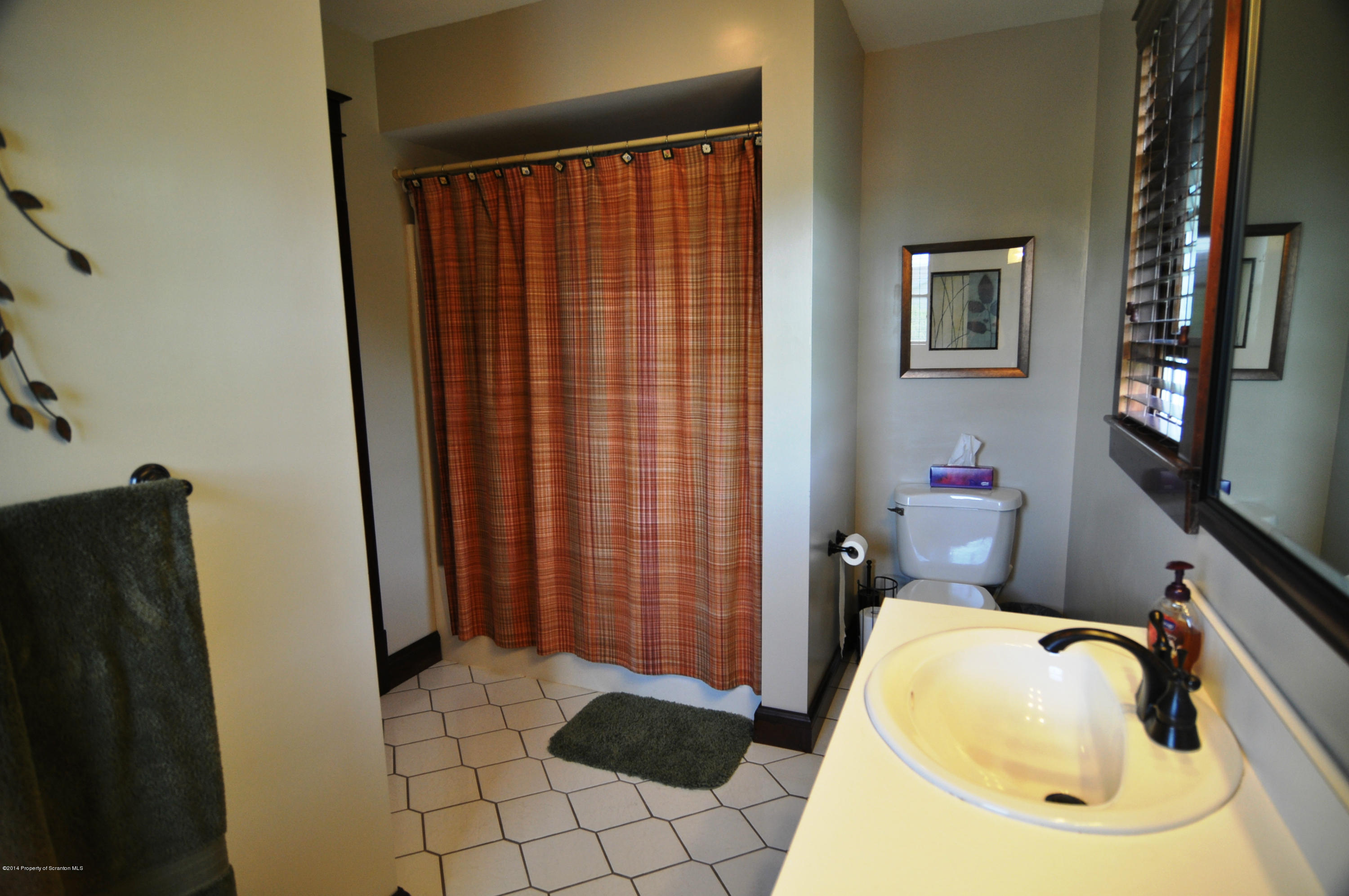 116 Griffin Road Moscow, PA 18444 - Photo 25 of 50 a bathroom with a sink and a mirror