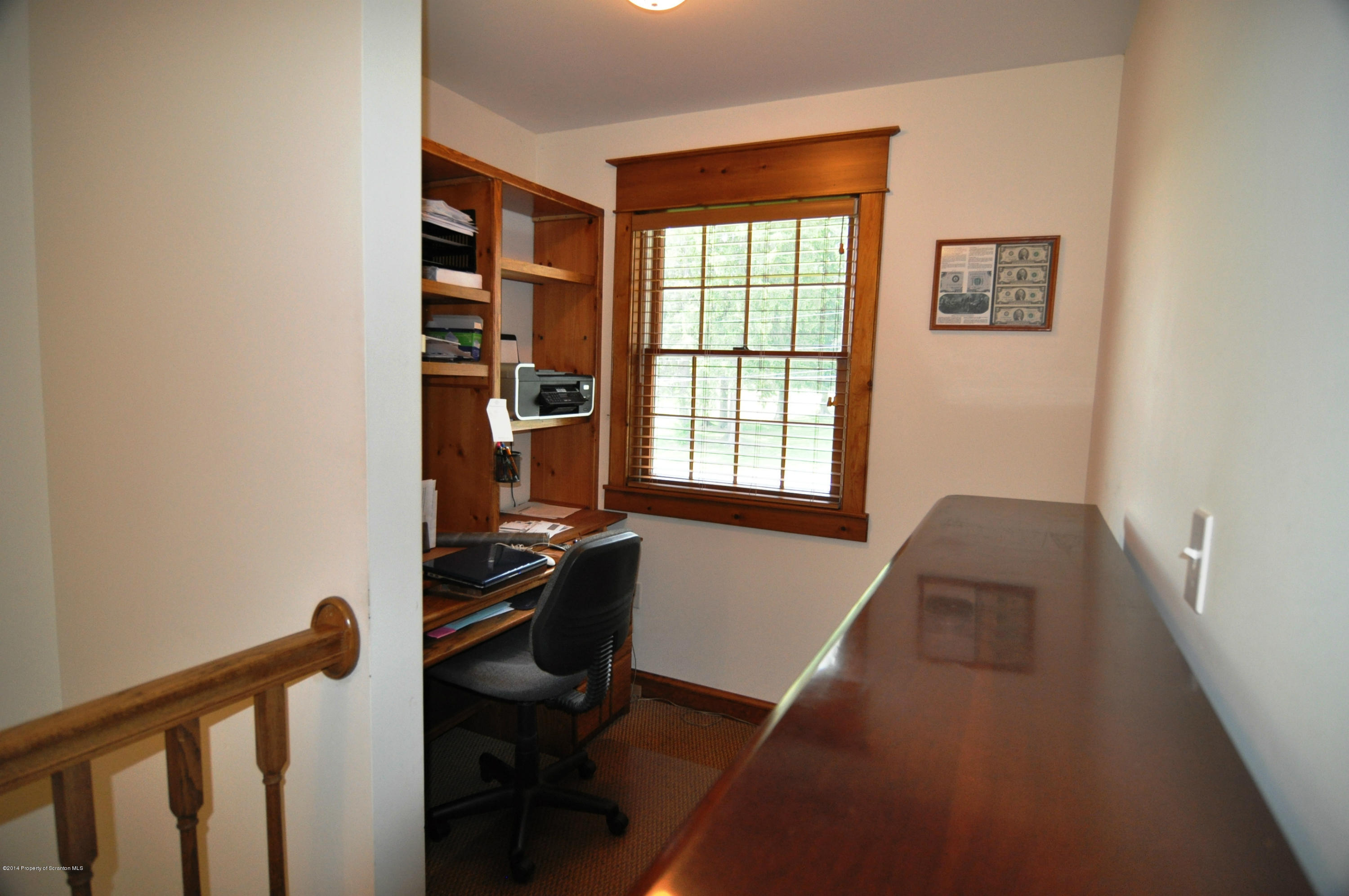 116 Griffin Road Moscow, PA 18444 - Photo 29 of 50 a view of a workspace with furniture and a window