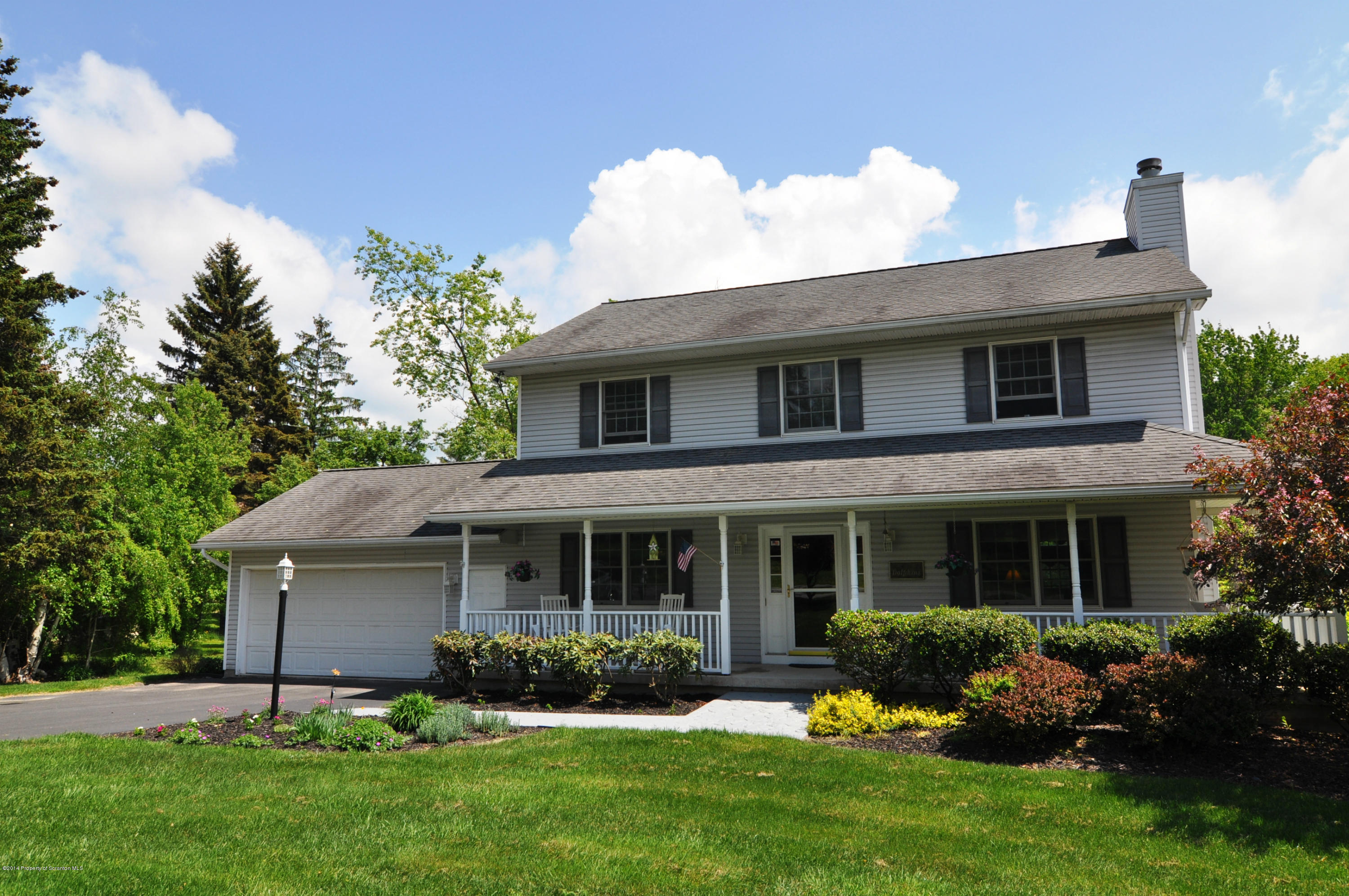 116 Griffin Road Moscow, PA 18444 - Photo 33 of 50 front view of a house with a yard