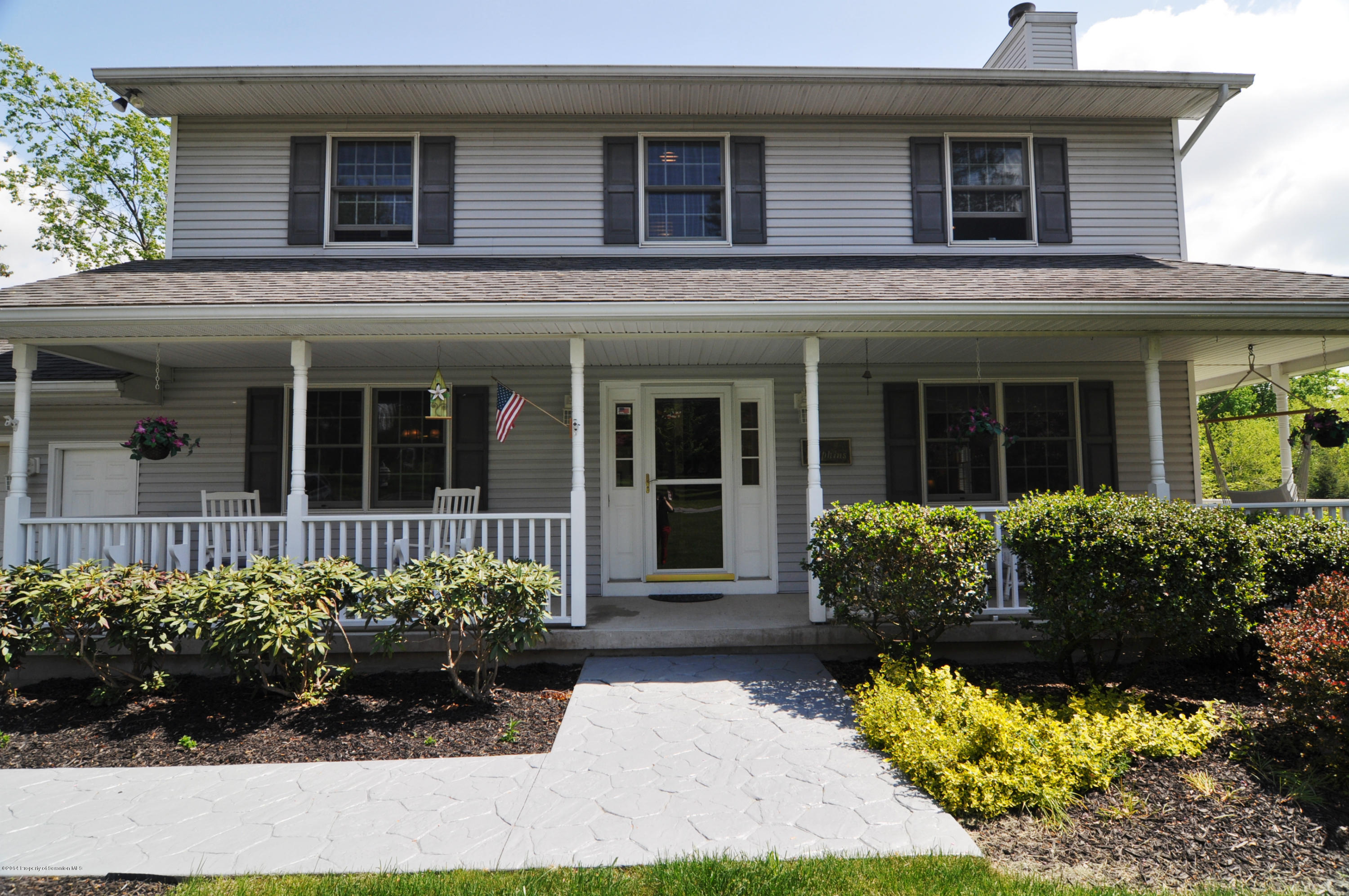 116 Griffin Road Moscow, PA 18444 - Photo 34 of 50 a front view of a house with a garden