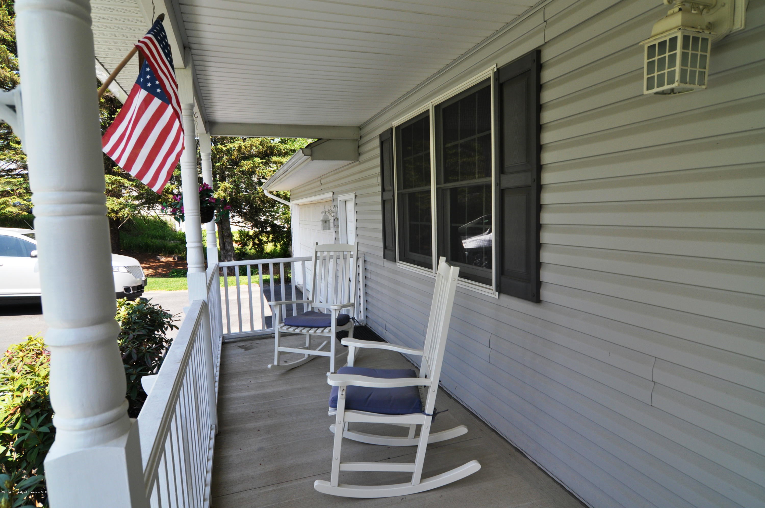 116 Griffin Road Moscow, PA 18444 - Photo 36 of 50 a balcony with chairs and potted plants