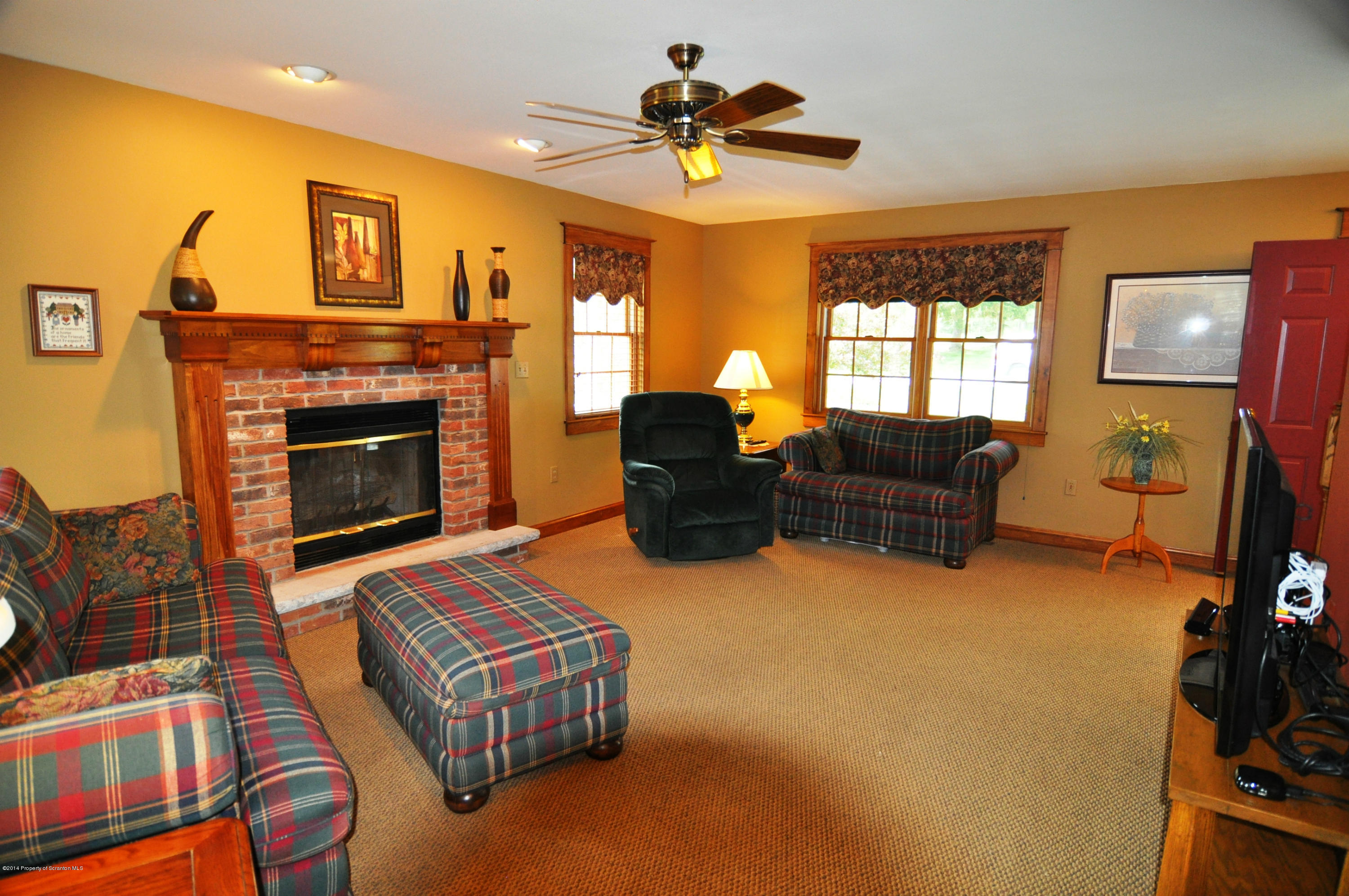 116 Griffin Road Moscow, PA 18444 - Photo 4 of 50 a living room with furniture fireplace and flat screen tv