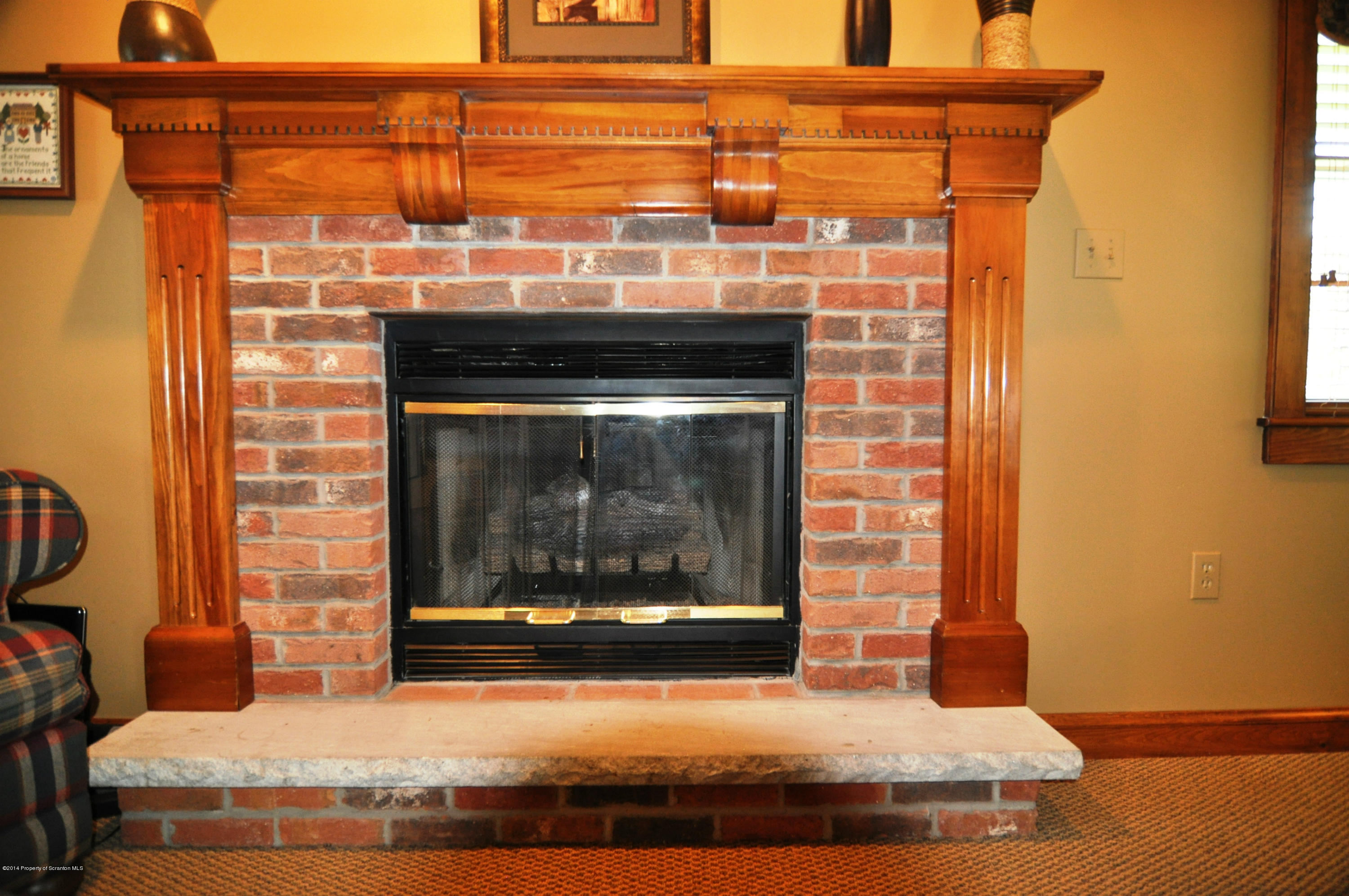116 Griffin Road Moscow, PA 18444 - Photo 7 of 50 a fireplace with wooden floor