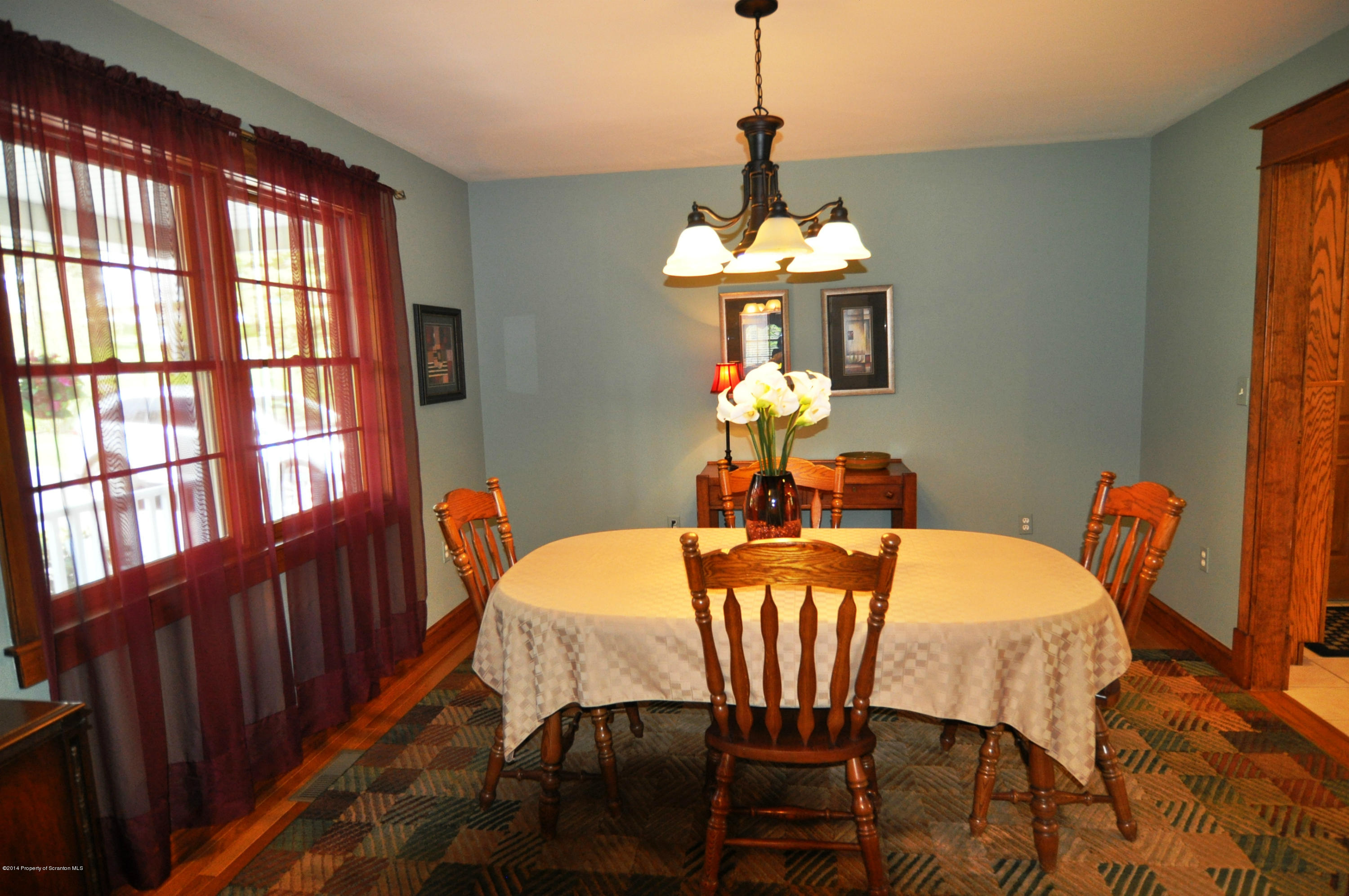 116 Griffin Road Moscow, PA 18444 - Photo 9 of 50 a dining room with furniture a chandelier and window