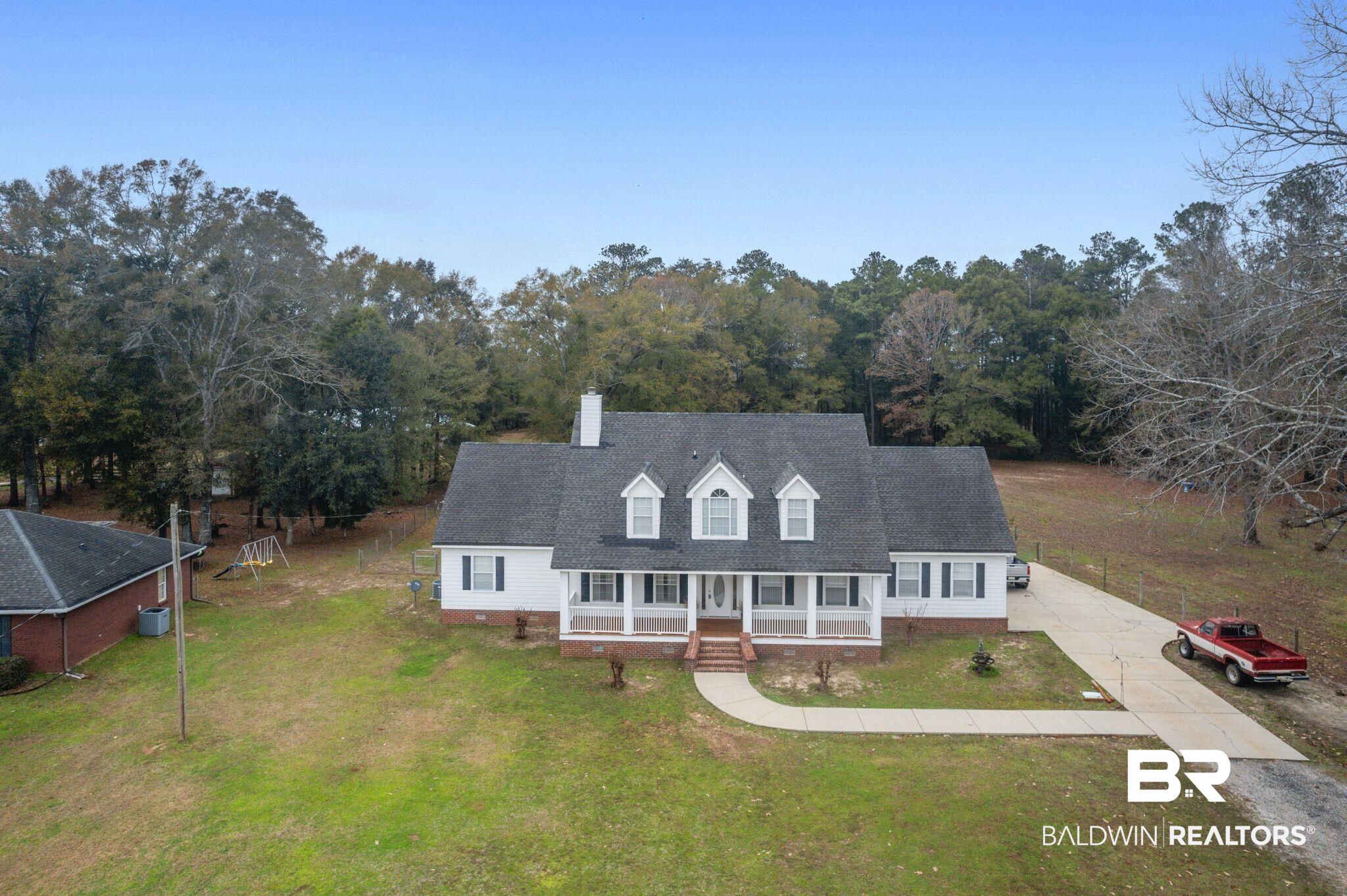9539 Lakeview Road Bay Minette, AL 36507 - Photo 35 of 45 Cape cod-style house featuring covered porch and a front yard