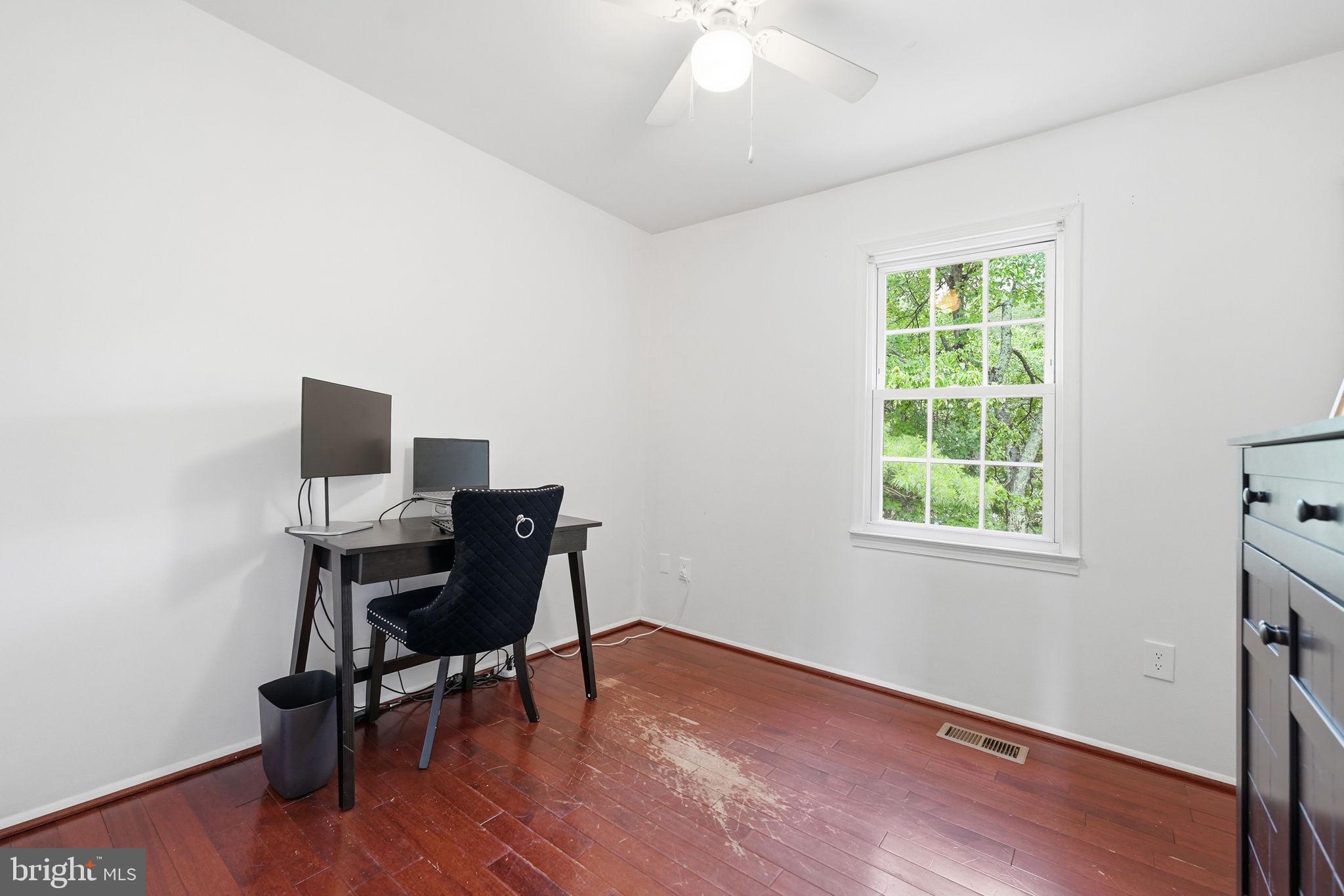 8260 Getty Court Springfield, VA 22153 - Photo 15 of 31 a workspace with furniture and a window