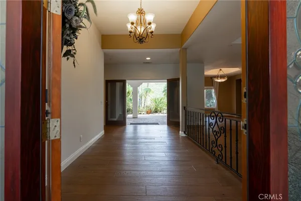 a view of a house with a small yard and plants