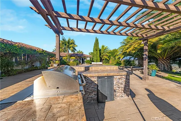 a bathroom with a granite countertop double vanity sink and mirror