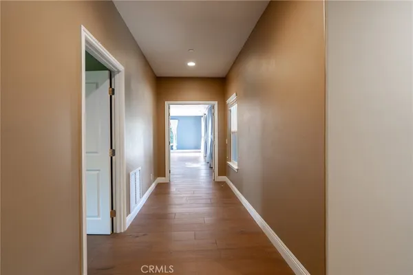 a spacious bathroom with a double vanity sink toilet and a tub