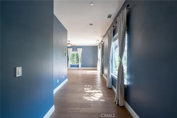 a spacious bathroom with a double vanity sink a mirror and a bathtub