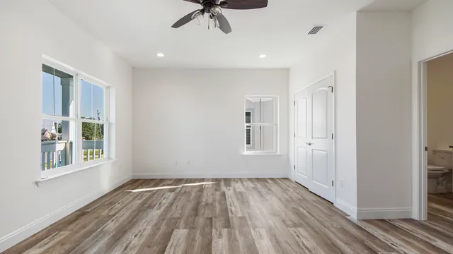 a view of room that has a white walls