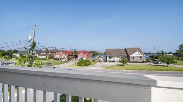 an aerial view of a pool patio swimming pool and ocean view