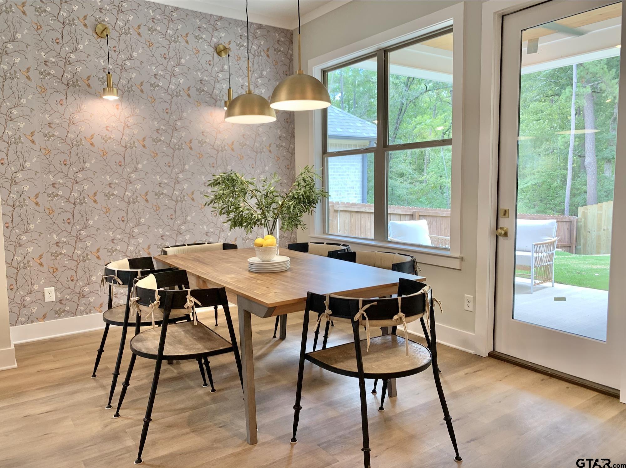 9115 Long Branch Tyler, TX 75703 - Photo 11 of 39 a view of a dining room with furniture window and wooden floor