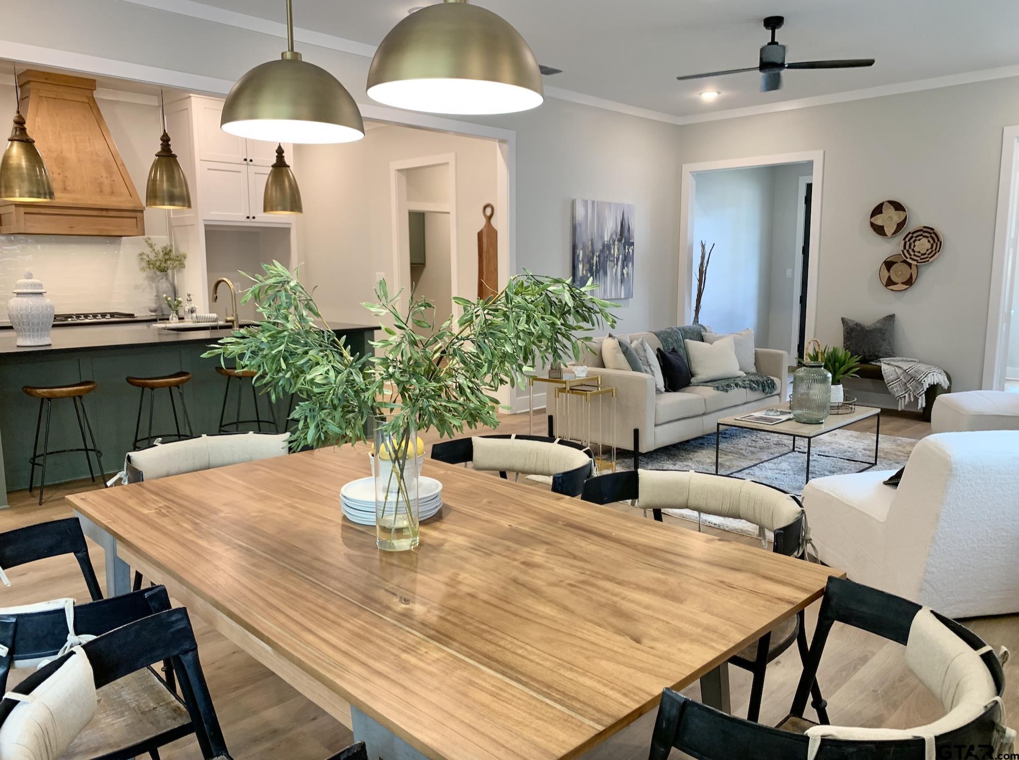 9115 Long Branch Tyler, TX 75703 - Photo 13 of 39 a dining room with furniture and a chandelier