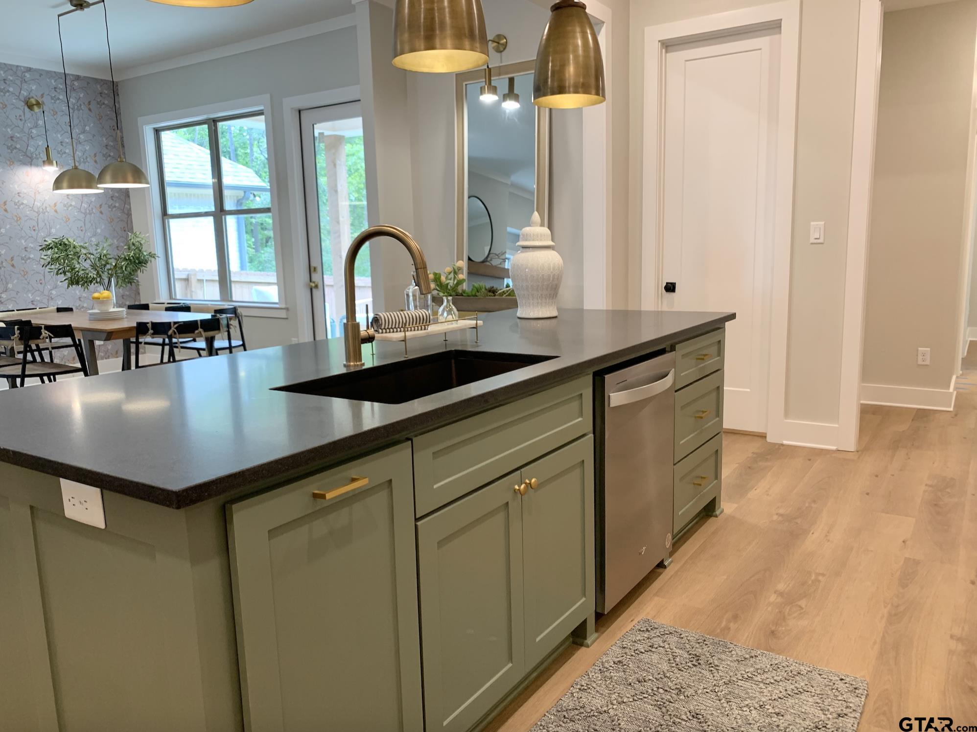 9115 Long Branch Tyler, TX 75703 - Photo 16 of 39 a kitchen with a sink and cabinets