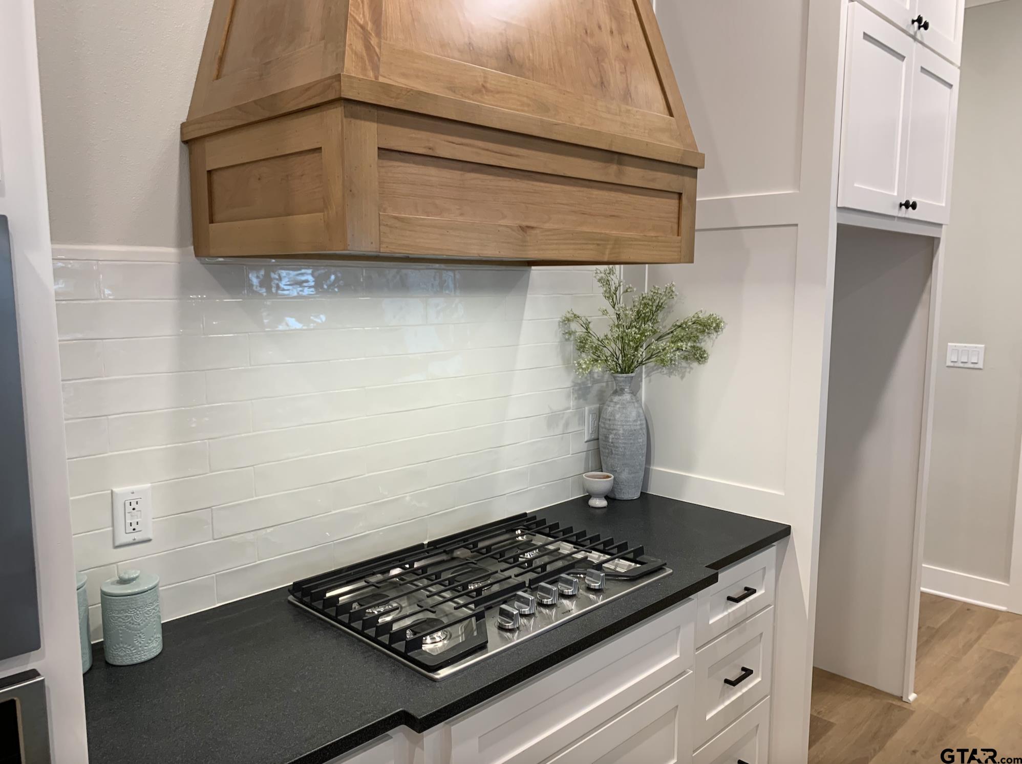 9115 Long Branch Tyler, TX 75703 - Photo 17 of 39 a stove top oven sitting inside of a kitchen
